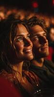 Couple enjoys an intimate moment during a concert filled with excitement and emotion in a vibrant venue photo