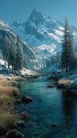 Snow-capped mountains rise majestically above a tranquil river surrounded by evergreen forests in a serene winter landscape photo