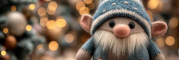 Cute handmade gnome decoration with a blue hat and cozy sweater surrounded by warm holiday lights photo