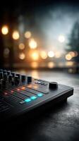 Electronic music production equipment with colorful lights in a dimly lit studio setting at night photo