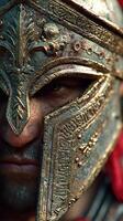 Warrior in ornate helmet with intricate designs and fierce expression during a historical reenactment photo