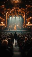 Audience watches a festive performance at a theater with holiday decorations and warm lighting during the winter season photo