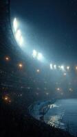 Heavy rain pours down on a packed stadium during a nighttime football match with bright lights illuminating the scene photo