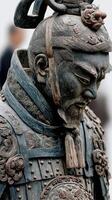 Intricate detail of a historic warrior statue displayed in an ancient art exhibition outdoors photo