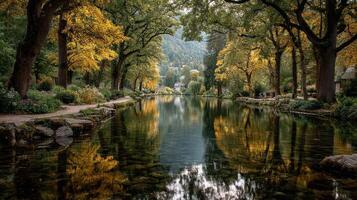 Calm river reflecting autumn foliage in a serene park with trees and vibrant colors photo