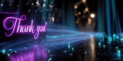 Thank you message illuminated with vibrant colors and sparkling lights in a dark setting photo