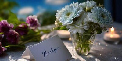 Beautiful bouquet with thank you card on table near candles during daytime in a serene setting photo