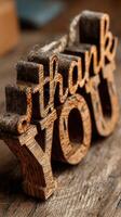 Thank you decoration made of wood placed on rustic wooden surface in cozy indoor setting photo