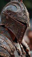 Highlight of intricate armor and helmet design worn by a warrior during a historical reenactment event in a park setting photo