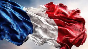 French flag waving against a clear sky during a sunny day symbolizing national pride and unity photo