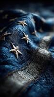 Detailed close-up view of an intricately embroidered flag with stars and stripes photo