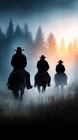 Cowboys riding through foggy forest at dawn with silhouettes against the colorful horizon photo