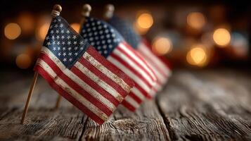 Small American flags on wooden table with warm bokeh background, perfect for patriotic celebrations and events photo