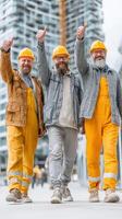 Three cheerful construction workers celebrating success on a city building site during daytime photo