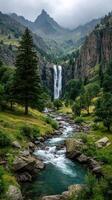 Majestic waterfall cascading down rocky cliffs in a lush green valley surrounded by mountains under a cloudy sky photo