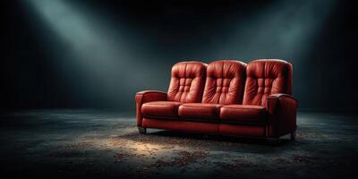 Elegant red leather sofa in a dimly lit room with a mysterious atmosphere and subtle shadows photo