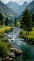 Serene river flows through lush valley surrounded by majestic mountains on a cloudy day photo
