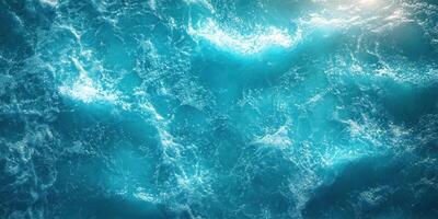 Vibrant ocean waves ripple beneath bright sunlight on a clear day photo