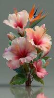 Colorful hibiscus and bird of paradise flowers arranged elegantly on a soft gray background showcasing nature's beauty photo