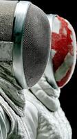 Fencers in activity during a competitive match showcasing their gear and focus at a sports event photo