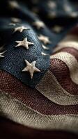 Close-up view of an American flag showcasing detailed stitching and fabric texture in warm natural light photo