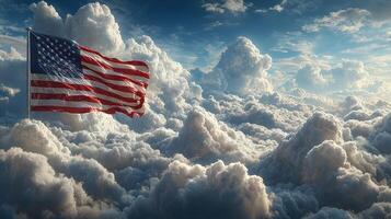 American flag waving above clouds at sunrise in a serene blue sky with fluffy white formations photo