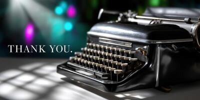Vintage typewriter with a thank you message on display in a dimly lit room during an evening event photo