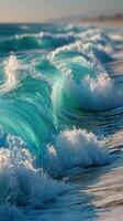 Turquoise waves crash onto the shore at sunset highlighting the beauty of the ocean photo