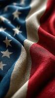 Close-up view of a United States flag draped on a surface, showcasing fabric texture and colors during a patriotic celebration photo