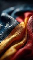 Close-up view of textured fabric showcasing vibrant colors of a flag during a soft light setting photo