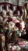 Elegant floral arrangement placed on a vintage chair in a refined interior setting during daylight photo