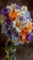 Colorful floral arrangement in a glass vase highlighting alstroemeria and sweet pea blossoms photo