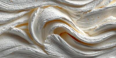 Whipped cream texture with soft swirls on a smooth surface in a bright kitchen setting photo