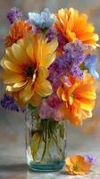 Colorful floral arrangement in a glass vase with vibrant blooms, captured in a still life setting photo
