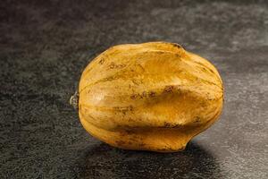 A squash on a table photo