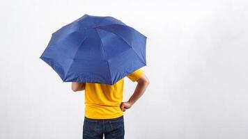 Rear view of man under umbrella isolated on white background photo