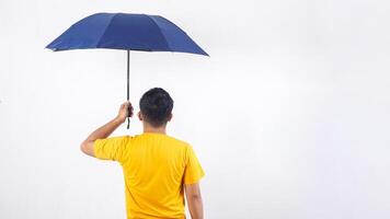 Rear view of man holding umbrella isolated on white background photo