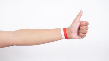 Man hand with red and white wristbands isolated on white background photo