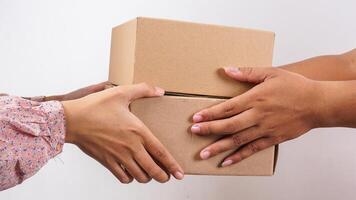 Close up of customer taking package boxes parcel given by delivery man isolated on white background photo