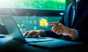 Businessman Using Cloud Computing for Secure Digital File Management on Laptop, Enhancing Remote Work Efficiency, Cybersecurity, and Data Protection for Online Collaboration, Virtual Office Solutions photo