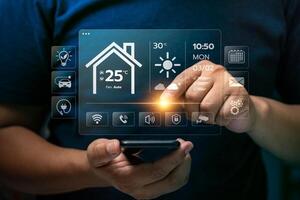 Businessman Using Smart Home Interface on Transparent Screen to Control Temperature, Lighting, and Smart Devices with Innovative Home Automation Technology for Comfort and Energy Efficiency photo