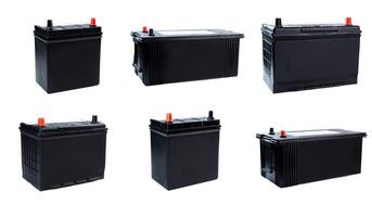 Six black car batteries of different sizes isolated on white background. Automotive power units for light vehicles and trucks. Ideal for catalog or shop. photo