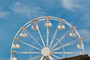 Partial White Ferris Wheel against Blue Sky at Sandhaven Beach, UK photo