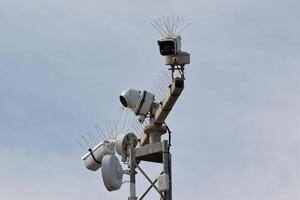 Surveillance Cameras on Metal Pole with Bird Deterrent Spikes photo