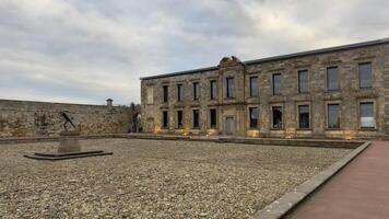 Building Facade with Statue in Stone Courtyard in Whitby photo