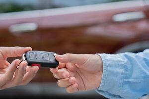 lease,sell, buy. Dealership manager send car keys to the new owner. Sales, loan credit financial, rent vehicle, insurance, renting, Seller, dealer, installment, car care business photo
