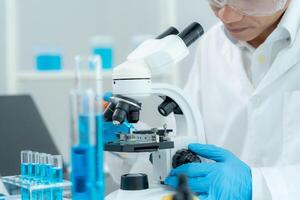 Scientist check chemical food residues in laboratory. Control experts inspect quality of fruits, vegetables. lab, hazard, ROHs, find prohibited substances, contaminate, Microscope, Microbiologist photo