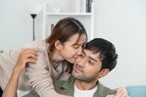 couple smile and happy hug each other eyes, cuddling, warm hugs, young love, married couple, warm family. Husband and wife in love so fun in new years eve or valentine day photo