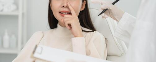 beauty asian smile and happy after surgery, surgical procedure that involve altering shape of nose, doctor examines patient nose before rhinoplasty, medical assistance, health photo