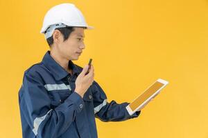 Engineer wear safety color back ground. inspector inspection by tablet, engineer project responsibility of inspecting. Service, industry, civil engineer, contactor, architect, quality assurance photo